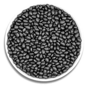 A white bowl filled with dry black beans, showcasing their smooth texture and deep black color.