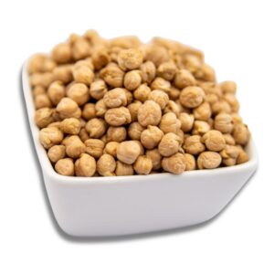 A white bowl filled with dry chickpeas (garbanzo beans), showcasing their texture and color.